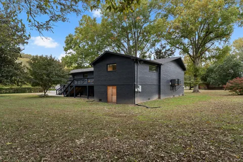 an aerial view of a forest with houses