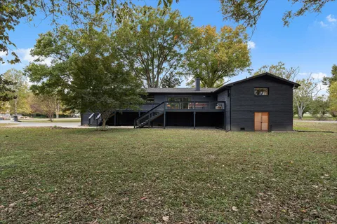 an aerial view of residential house with outdoor space