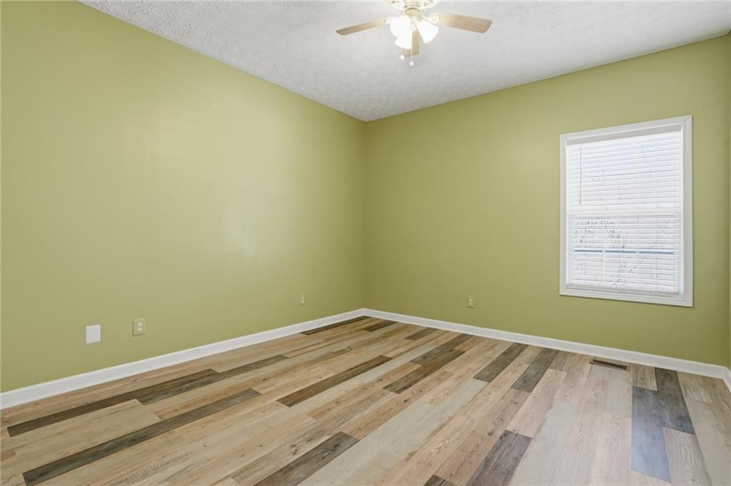3664 McEver Lake Road Pendergrass, GA 30567 - Photo 17 of 39 an empty room with a window