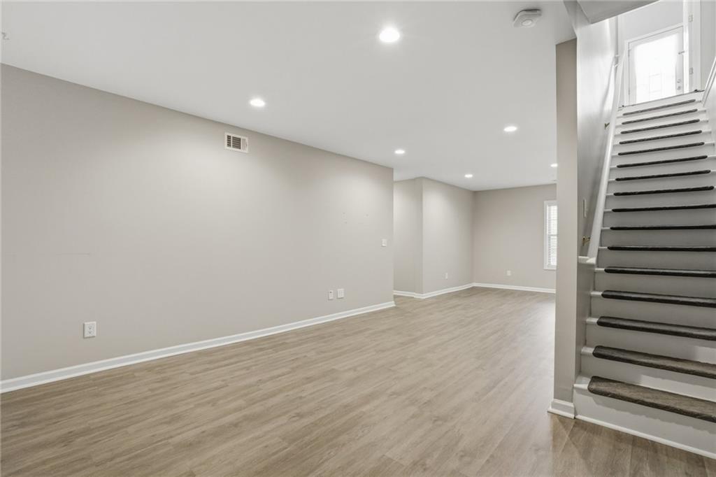 3664 McEver Lake Road Pendergrass, GA 30567 - Photo 21 of 39 an empty room with wooden floor