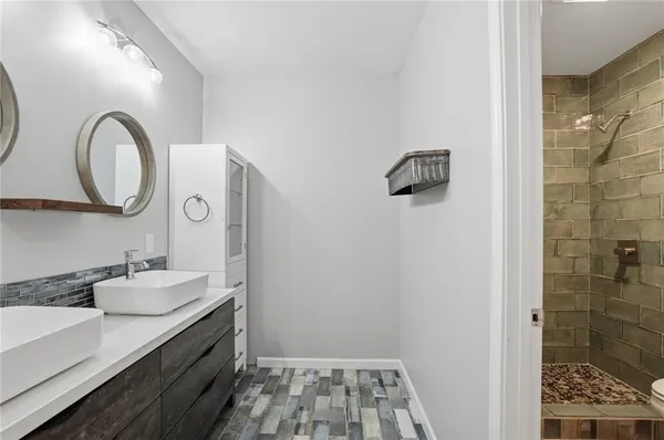 a bathroom with a sink and a mirror