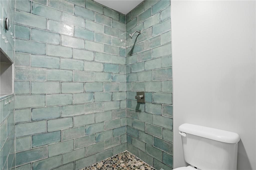 3664 McEver Lake Road Pendergrass, GA 30567 - Photo 27 of 39 a bathroom with a shower