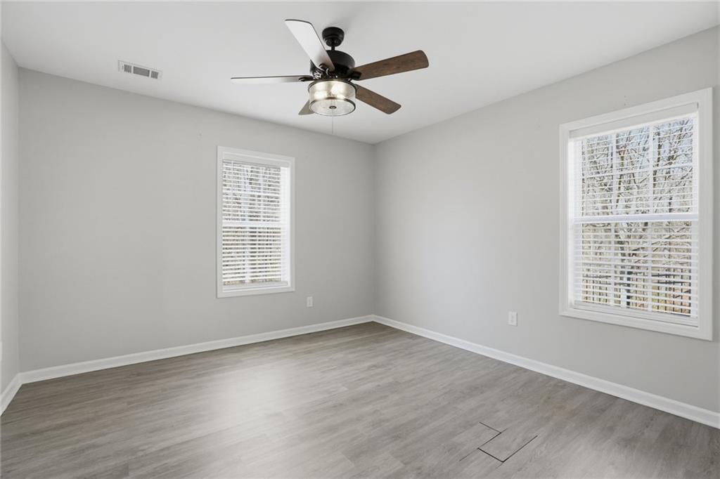 3664 McEver Lake Road Pendergrass, GA 30567 - Photo 28 of 39 a view of a livingroom with a ceiling fan and window