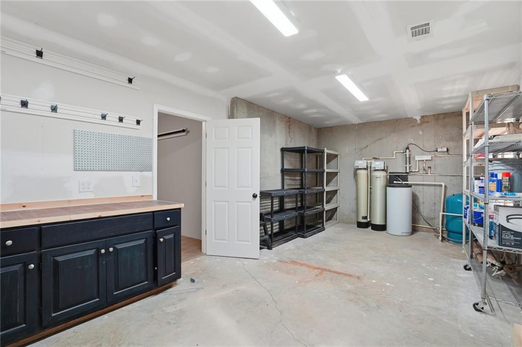 3664 McEver Lake Road Pendergrass, GA 30567 - Photo 31 of 39 a kitchen with refrigerator and cabinets
