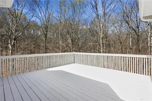 a balcony with wooden floor
