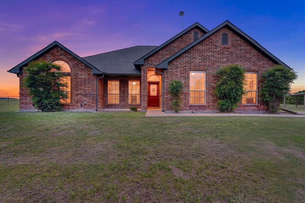 2828 Bennett Road Howe, TX 75459 - Photo 1 of 39 a front view of a house with a yard