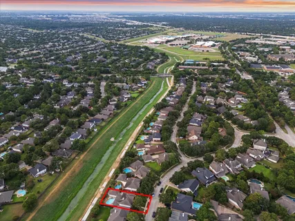 an aerial view of city and green space