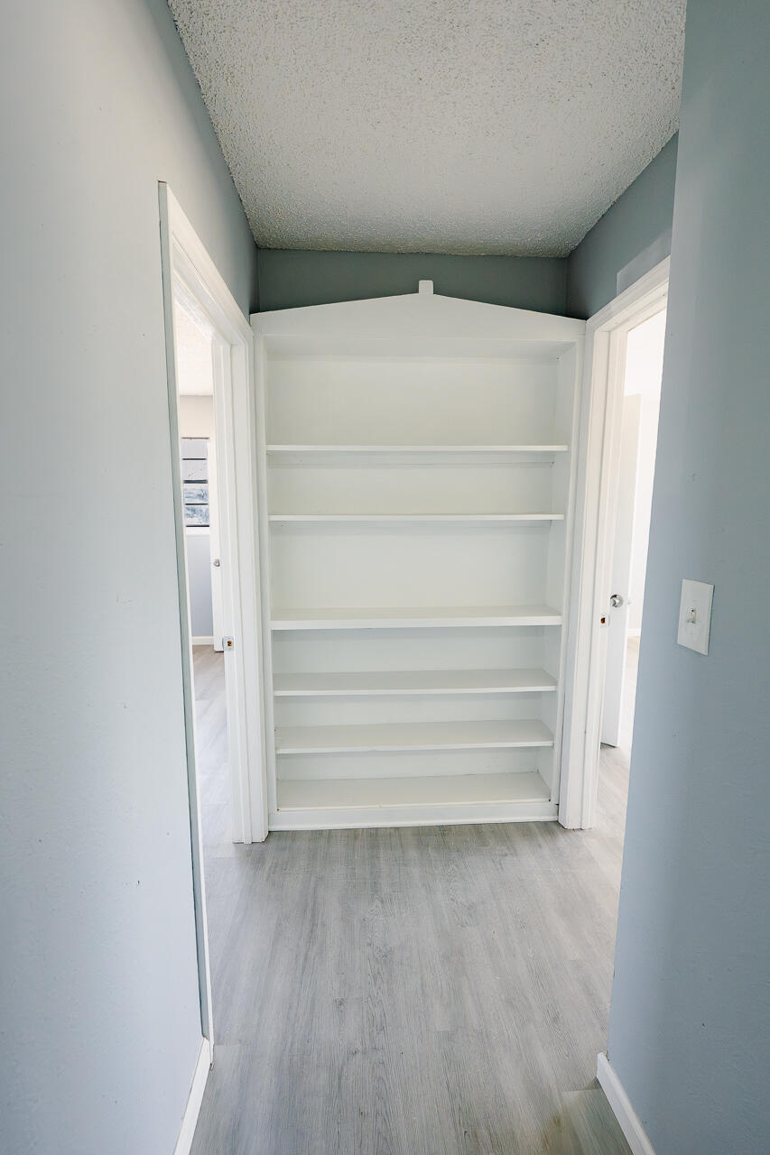 2802 40th Street Lubbock, TX 79413 - Photo 11 of 21 a view of walk in closet with empty racks