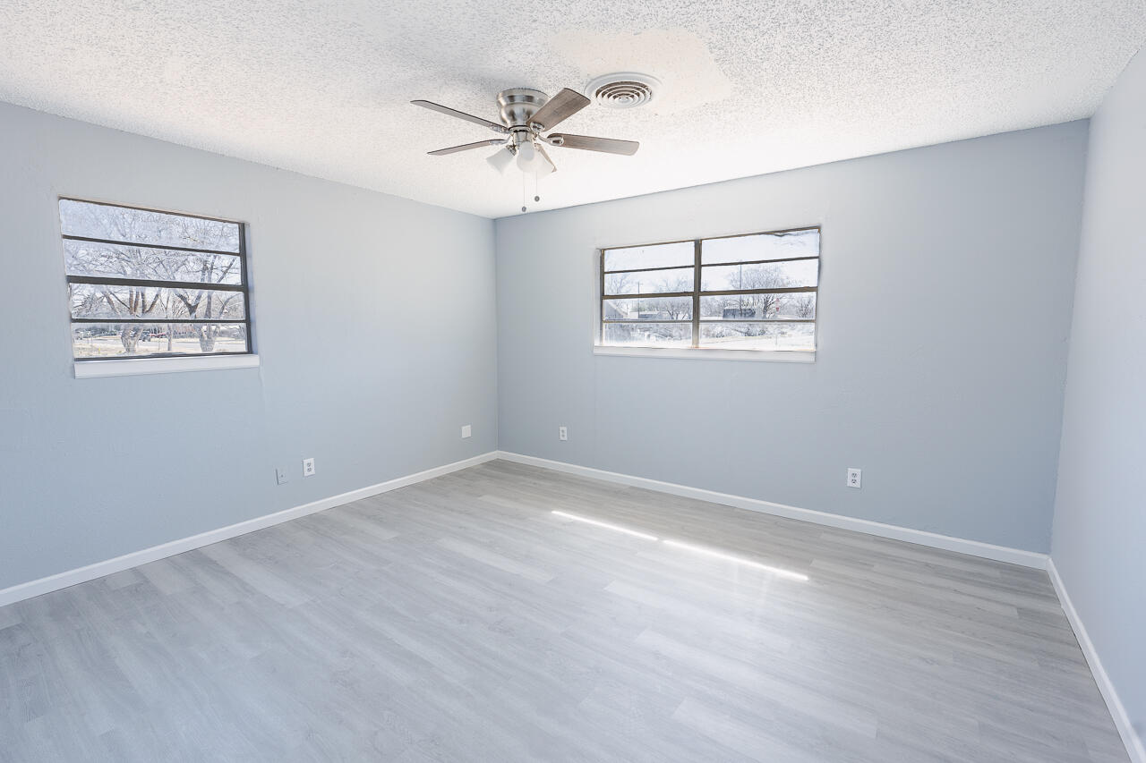 2802 40th Street Lubbock, TX 79413 - Photo 12 of 21 a view of an empty room with a window