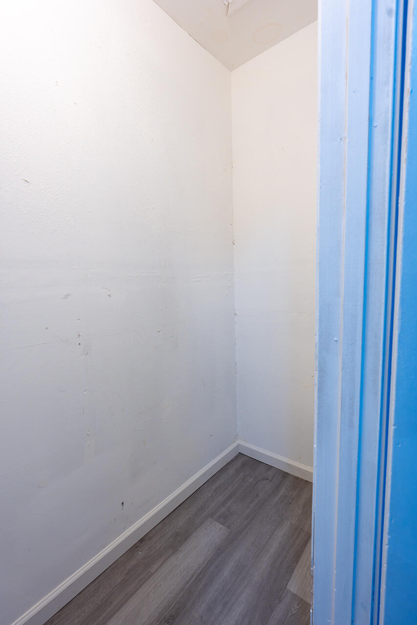 2802 40th Street Lubbock, TX 79413 - Photo 16 of 21 a view of a small space with wooden floor and a window