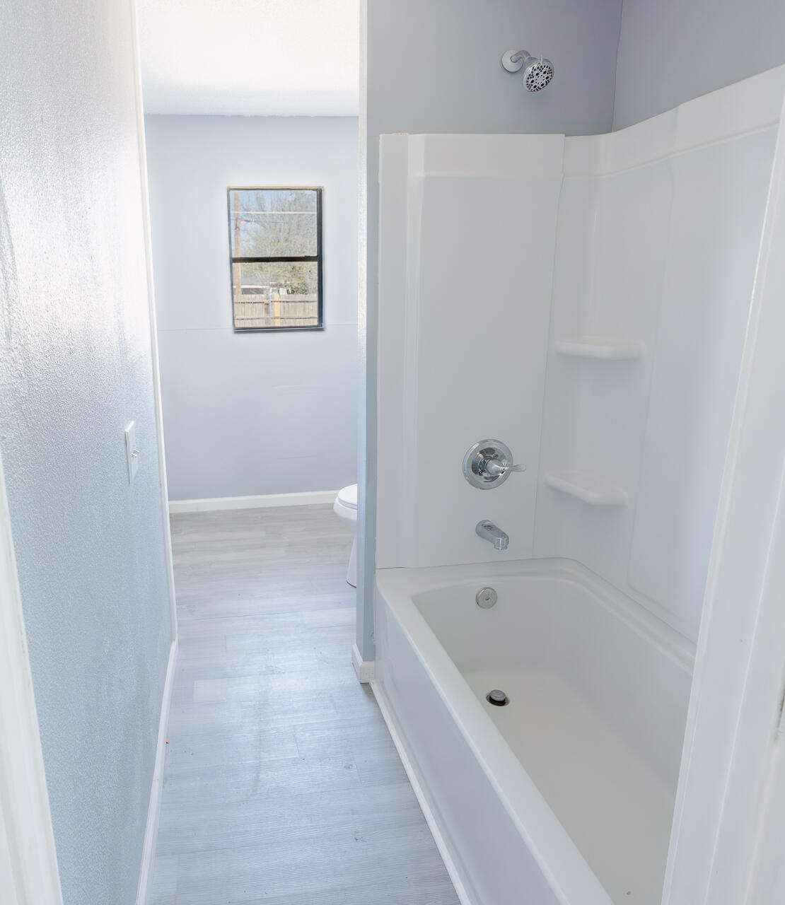 2802 40th Street Lubbock, TX 79413 - Photo 17 of 21 a bathroom with a bathtub