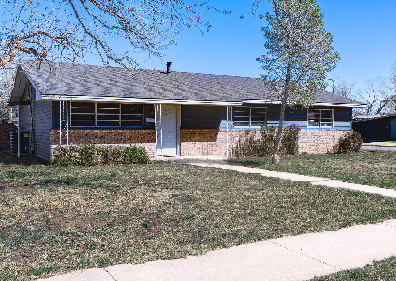 2802 40th Street Lubbock, TX 79413 - Photo 2 of 21 a front view of a house with garden