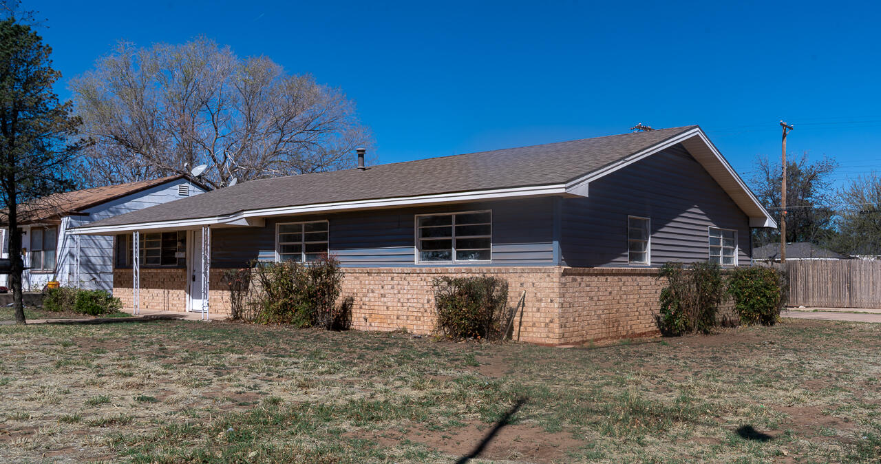 2802 40th Street Lubbock, TX 79413 - Photo 3 of 21 a front view of a house with garden