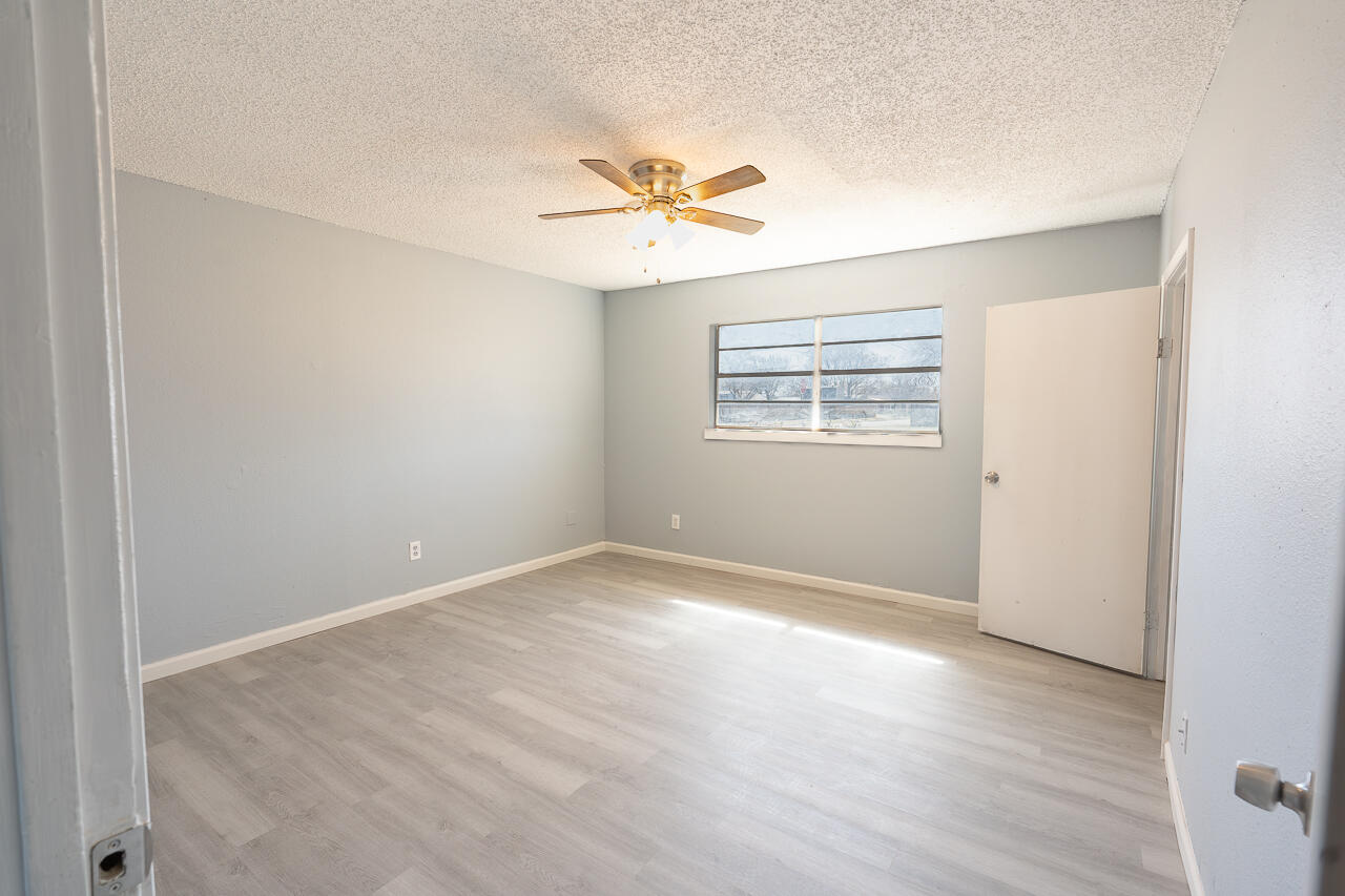 2802 40th Street Lubbock, TX 79413 - Photo 9 of 21 a view of an empty room with a window
