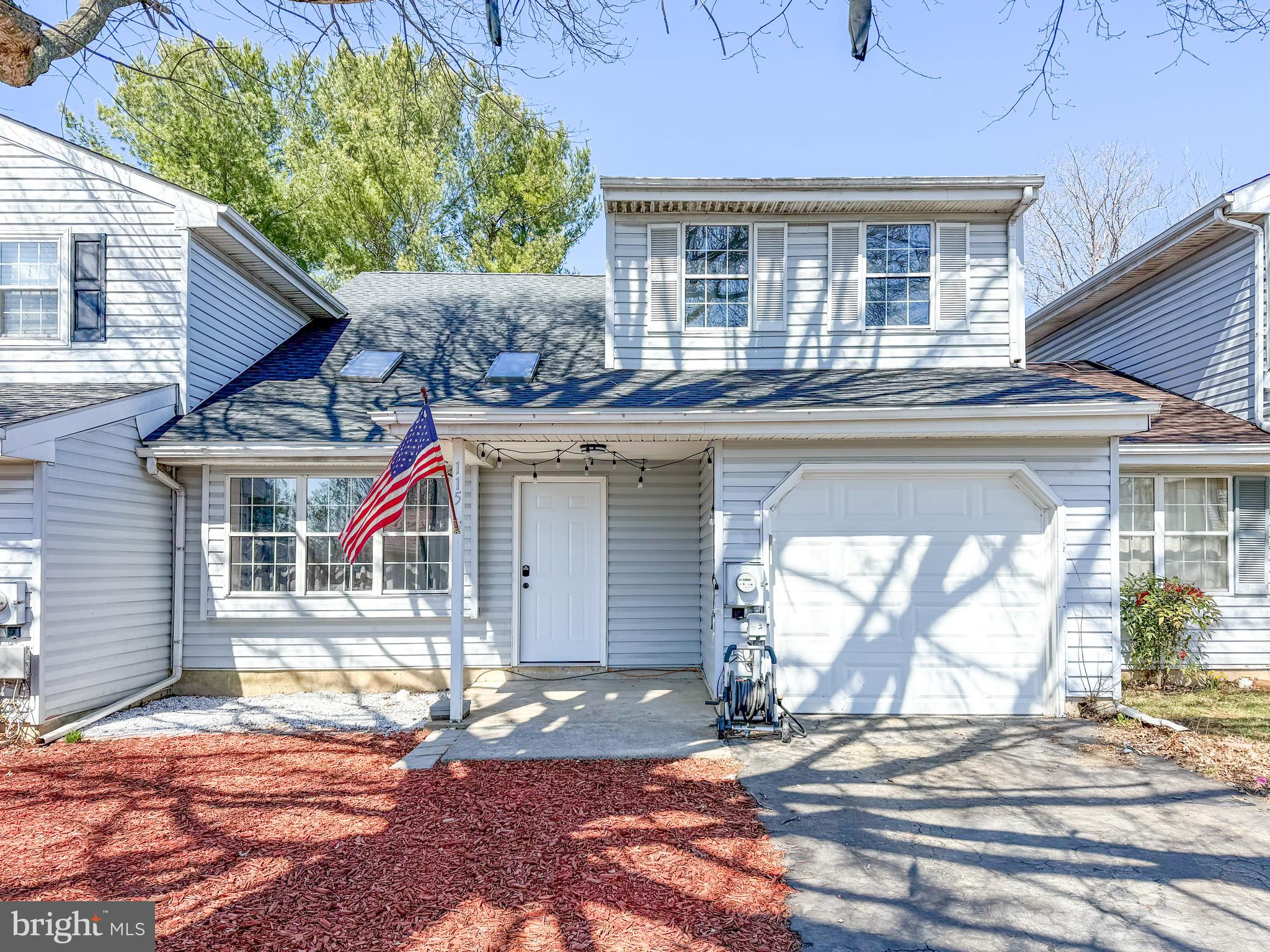 115 Upper Valley Lane Newark, DE 19711 - Photo 1 of 21 a front view of a house with a yard and potted plants