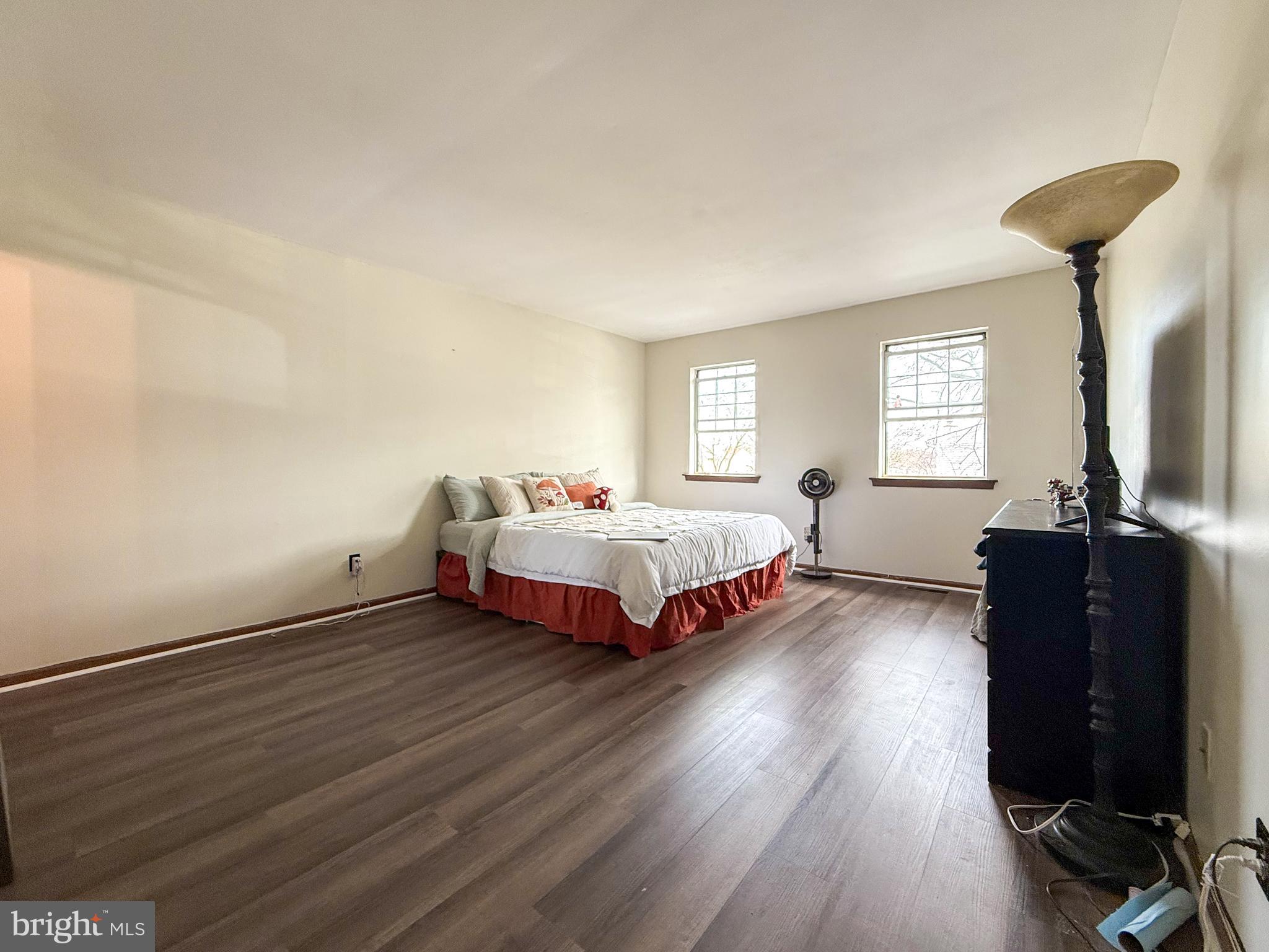 115 Upper Valley Lane Newark, DE 19711 - Photo 16 of 21 a bedroom with a bed and wooden floor