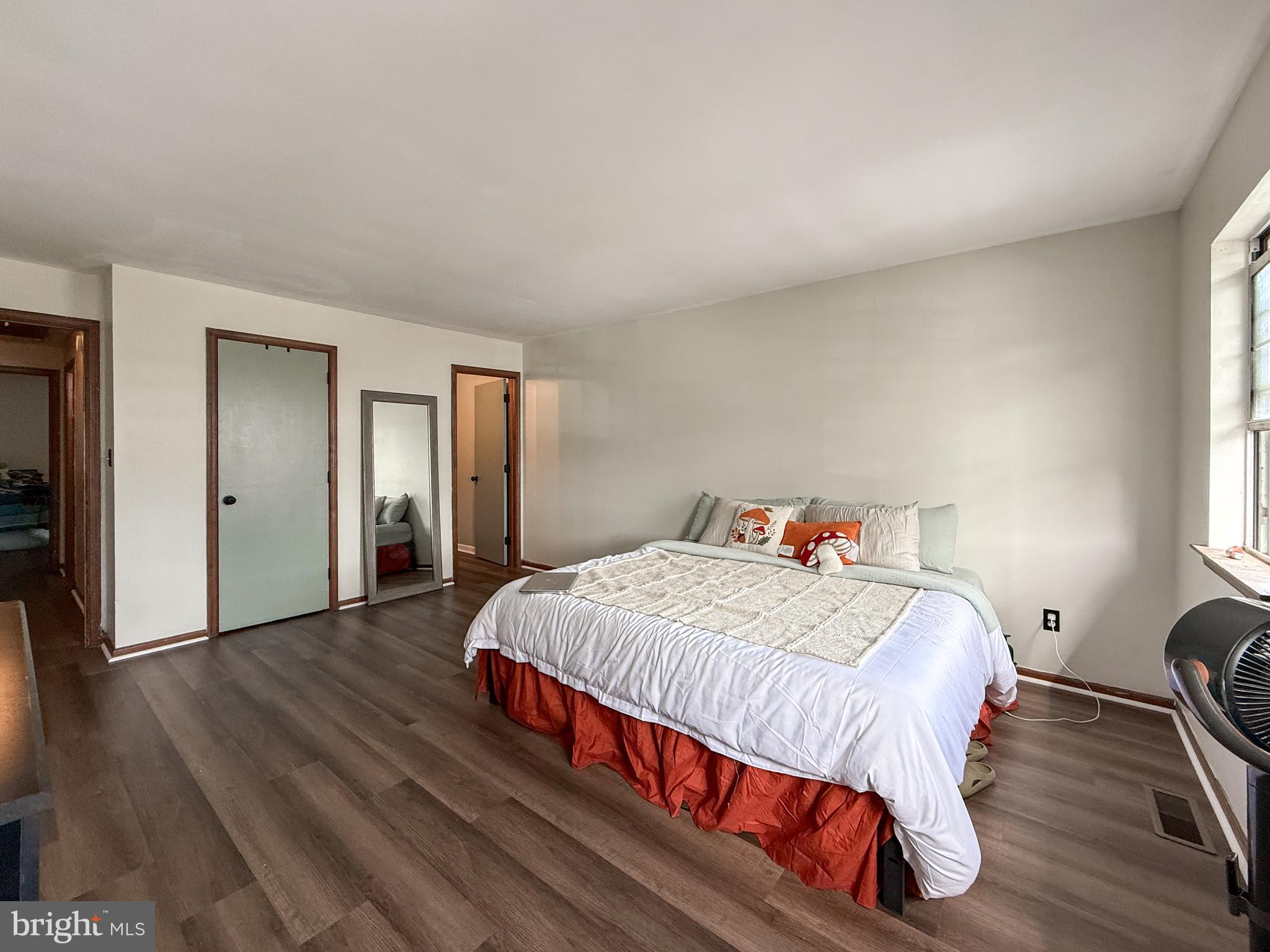115 Upper Valley Lane Newark, DE 19711 - Photo 17 of 21 a bedroom with a bed and wooden floor