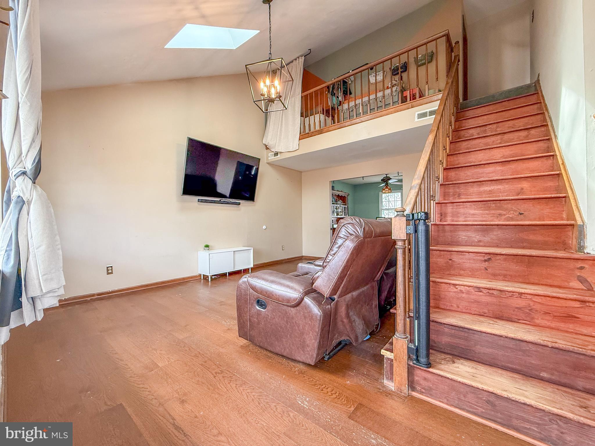 115 Upper Valley Lane Newark, DE 19711 - Photo 2 of 21 a living room with furniture and a flat screen tv