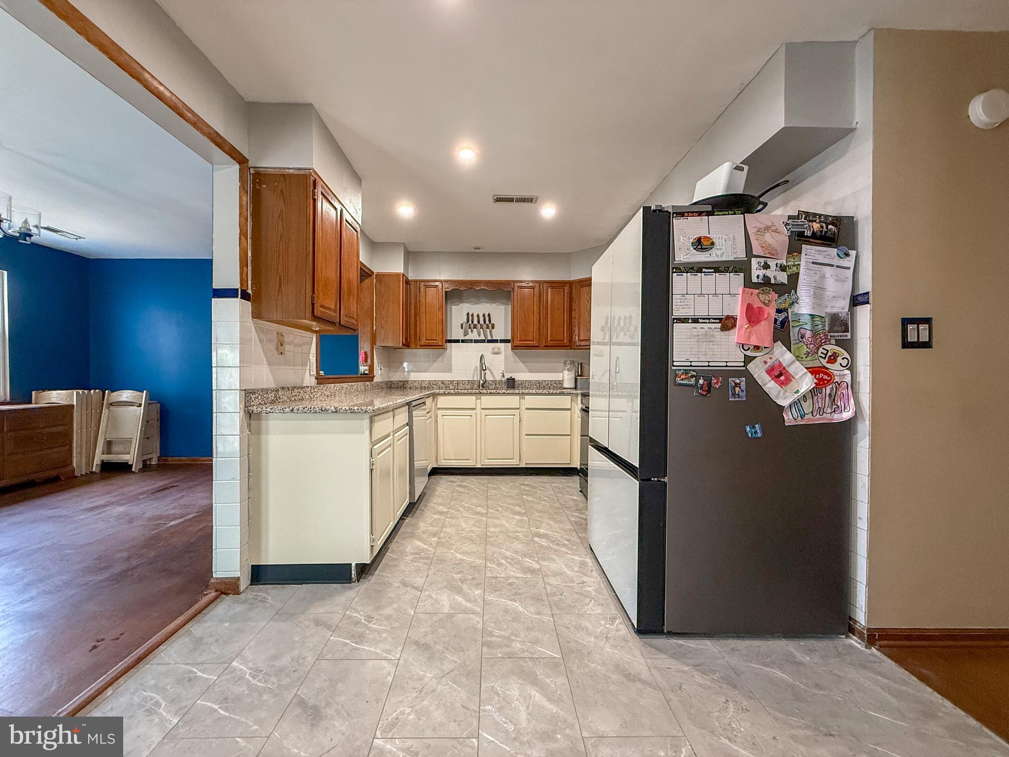 115 Upper Valley Lane Newark, DE 19711 - Photo 8 of 21 a kitchen with refrigerator and cabinets
