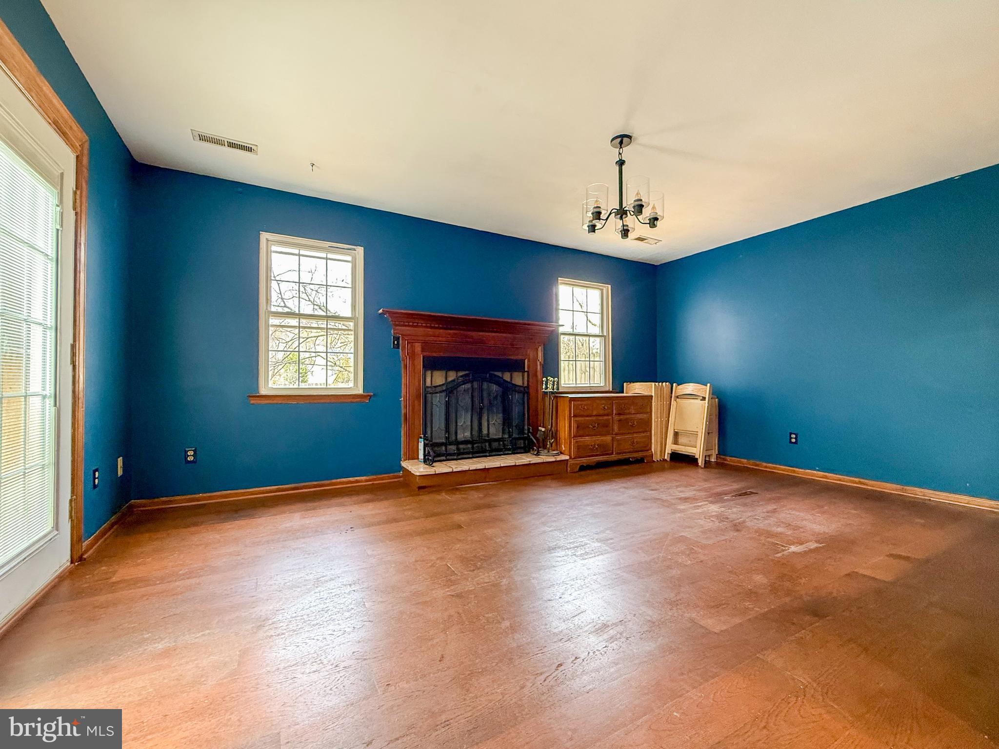 115 Upper Valley Lane Newark, DE 19711 - Photo 10 of 21 a view of an empty room with window and fireplace