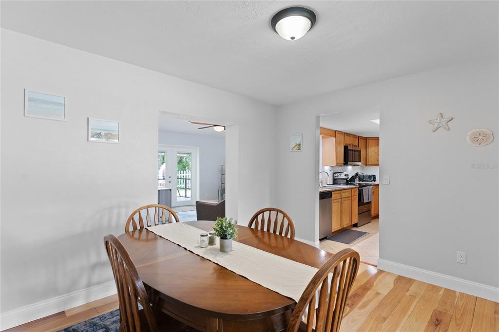 909 Bentwood Lane, Unit 1 Port Orange, FL 32127 - Photo 16 of 36 a view of a dining room with furniture