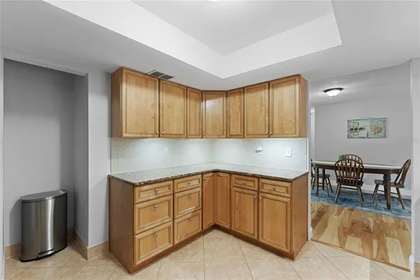 a kitchen with a sink cabinets and window