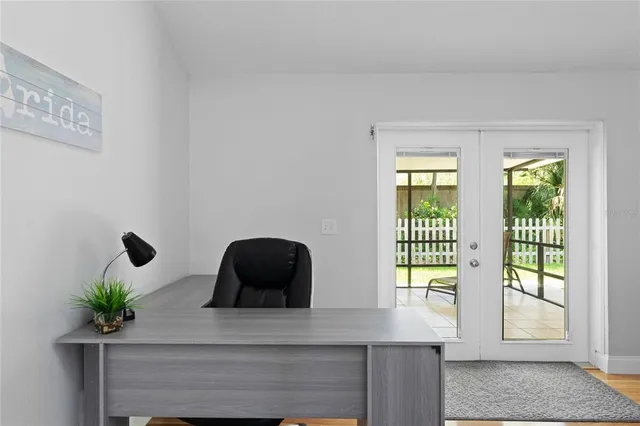 a sink with a potted plant next to a window
