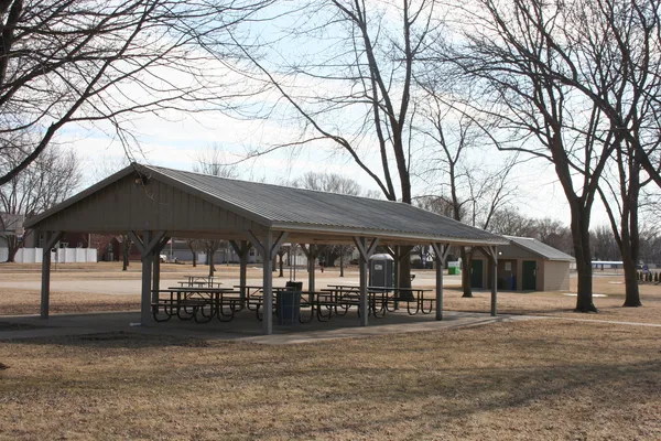a front view of a house and trees