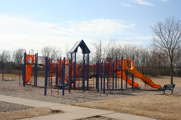 a view of a park with iron fence