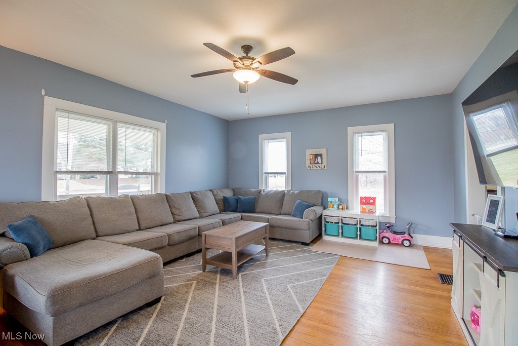 5693 South Ridge Road Madison, OH 44057 - Photo 23 of 45 Large family room has beautiful wood floors, newer windows with blinds