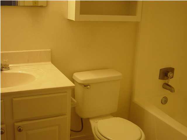 101 Old Ferry Road, Unit 3B Shalimar, FL 32579 - Photo 5 of 6 a bathroom with a toilet and a sink