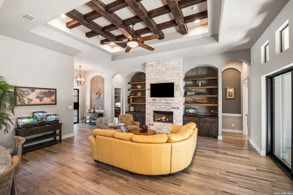 a living room with furniture and wooden floor