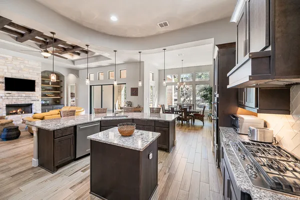 a view of a dining room with furniture and chandelier