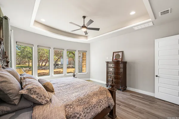 a bathroom with a granite countertop toilet a sink and a bathtub