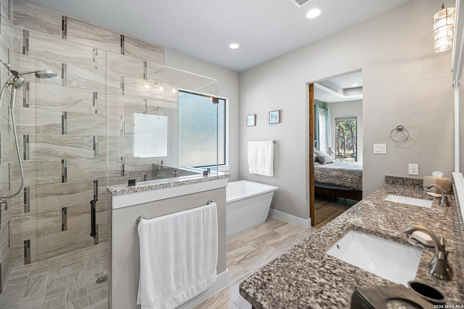 407 Havasu Spring Branch, TX 78070 - Photo 28 of 70 a spacious bathroom with a granite countertop sink a mirror and a bathtub