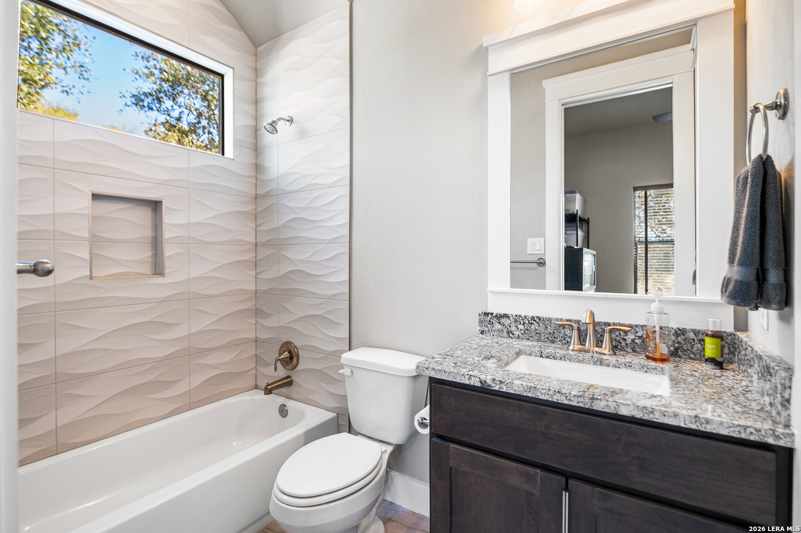 407 Havasu Spring Branch, TX 78070 - Photo 31 of 70 a bathroom with a granite countertop toilet a sink and a bathtub