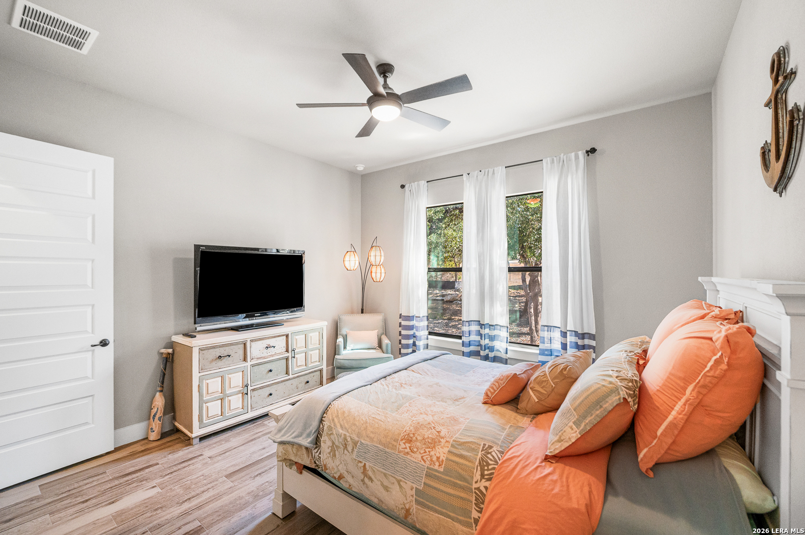 407 Havasu Spring Branch, TX 78070 - Photo 39 of 70 a bedroom with a bed and a flat screen tv with wooden floor