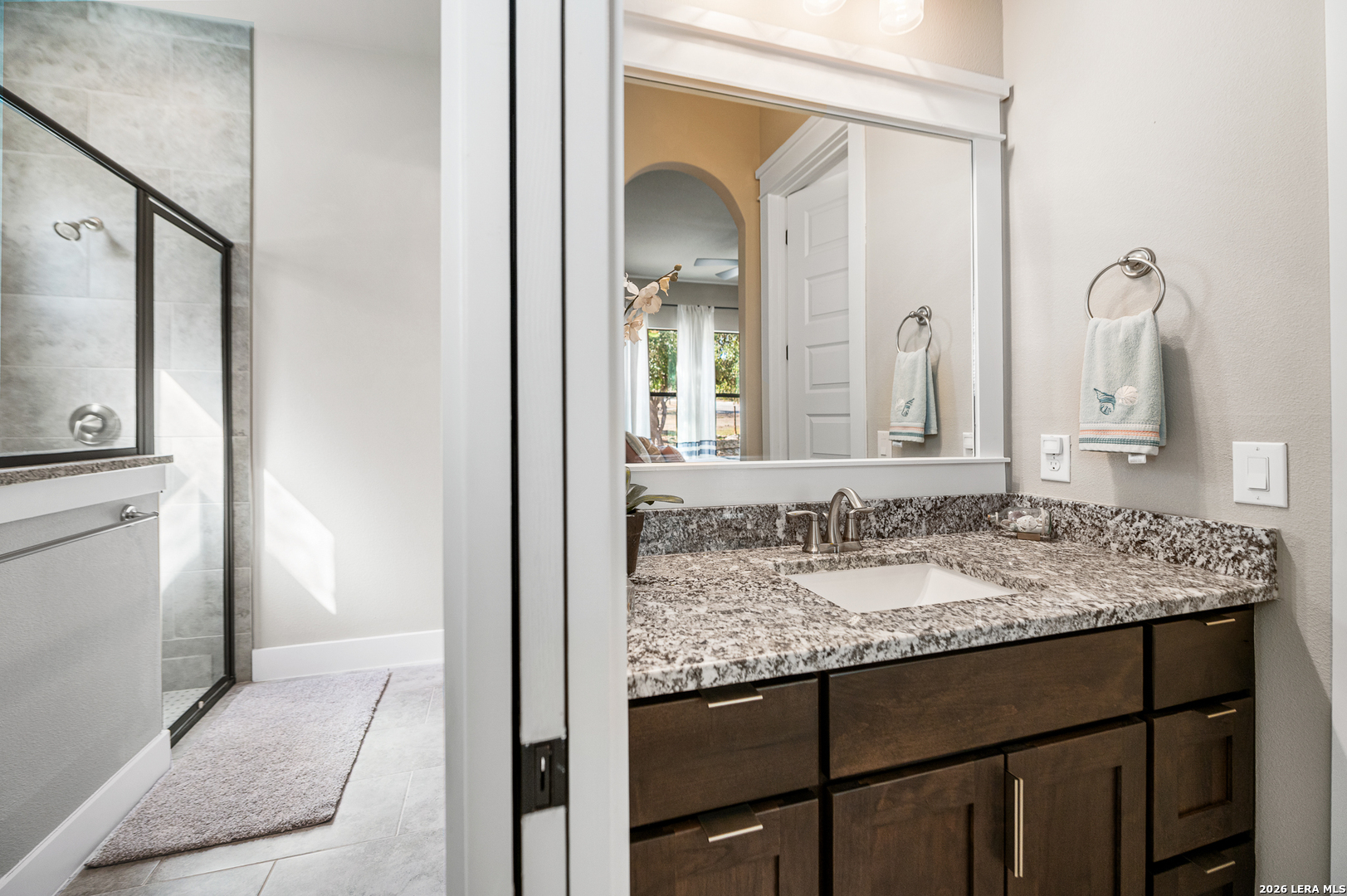 407 Havasu Spring Branch, TX 78070 - Photo 41 of 70 a bathroom with a granite countertop sink and a mirror