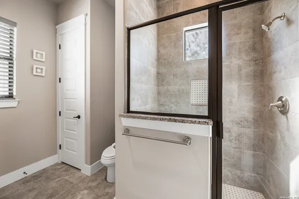 a living room with furniture a ceiling fan and a rug