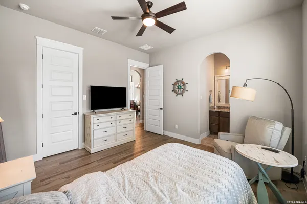 a view of a livingroom with a furniture and floor to ceiling window