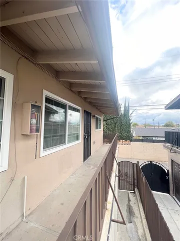 a view of balcony with furniture
