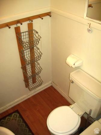 642 East 700 North Logan, UT 84321 - Photo 32 of 33 Half bathroom with toilet and wood finished floors