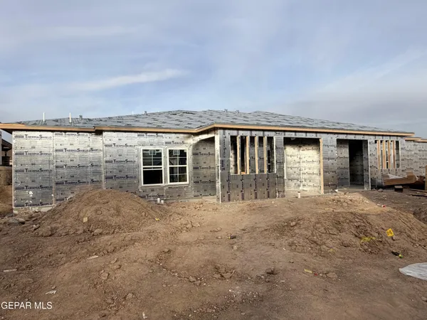 a view of house with backyard space