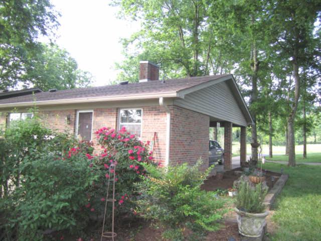 2050 Vales Mill Road Pulaski, TN 38478 - Photo 11 of 20 Back & Side Landscaping Gardens Just off the Back Deck & Carport (Also Parking for 2 More Cars in the Detached Garage Shop)