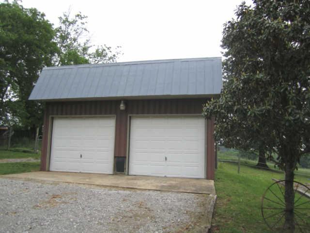 2050 Vales Mill Road Pulaski, TN 38478 - Photo 12 of 20 This Detached 2 Car Garage/Shop, has 1 Auto Door & is wired & has room for tools & benches.