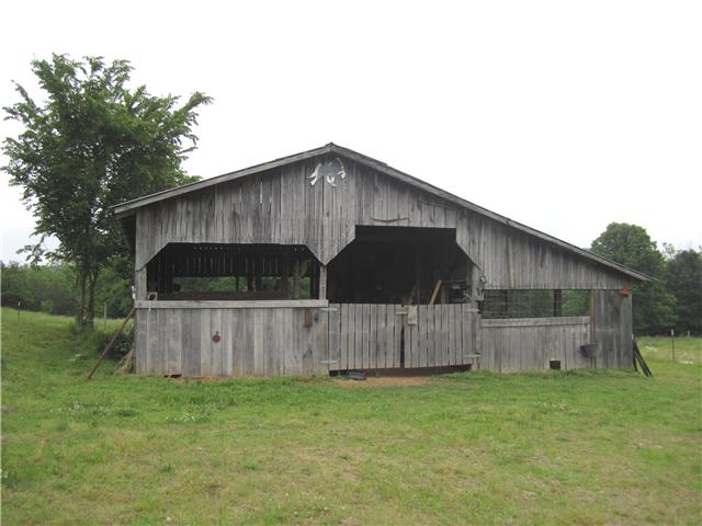 2050 Vales Mill Road Pulaski, TN 38478 - Photo 13 of 20 Barn has a wide hall way and stalls going down both sides and has been used for horses, cows, chickens & rabbits.