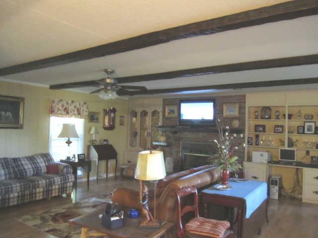 2050 Vales Mill Road Pulaski, TN 38478 - Photo 5 of 20 Spacious Great Room w/Fireplace & Built-In China/Gun Cabinet & Built-In Desk/Book Case & Built-In Corner Cabinet & 4 Full Length Windows w/Lots of Natural Light