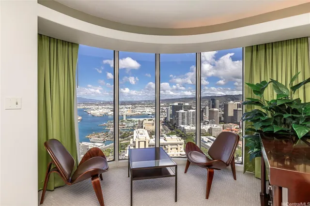 a spacious bedroom with a large bed and a large window