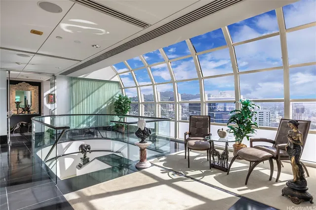 a bedroom with a bed mirror and a window