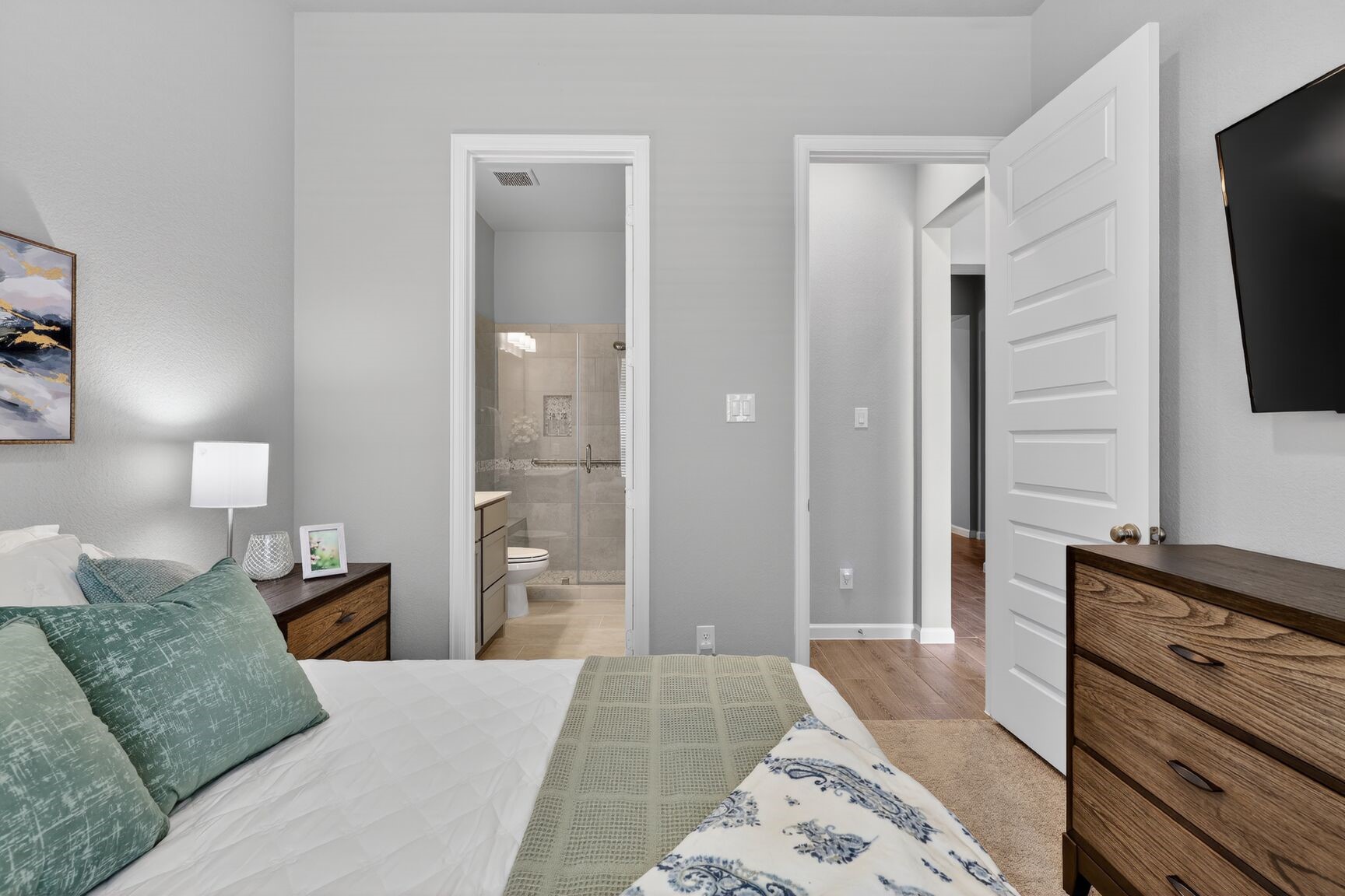 The spacious room features its own private ensuite bathroom, making it the perfect "home within a home" for long-term guests, in-laws, or a sophisticated nursery.